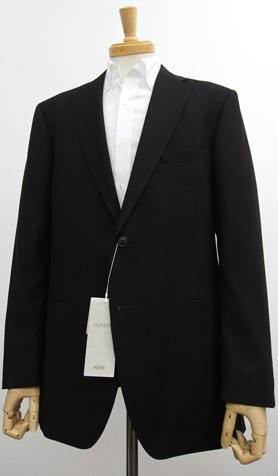 日本製特価[新品]定価81400円 ダーバン定番 日本製 ブラックスーツ (冠婚葬祭 略礼服 フォーマルスーツ) シングル ノータック D'URBAN ブラックスーツ